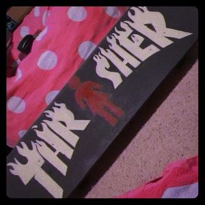 Customized skateboard with Trasher design x